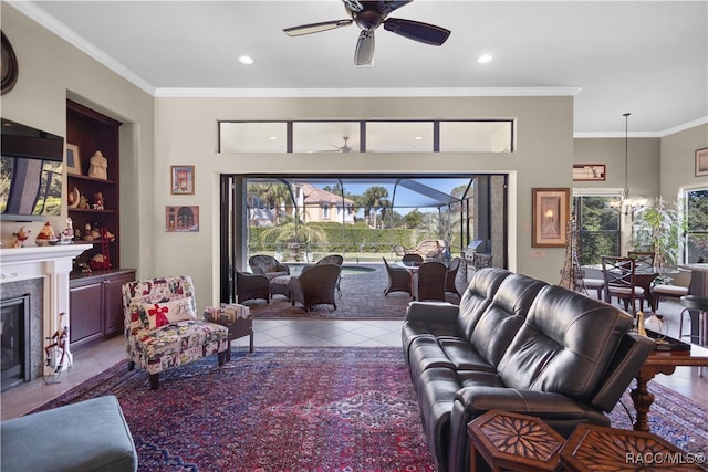 tiled living room with ceiling fan, built in features, and crown molding