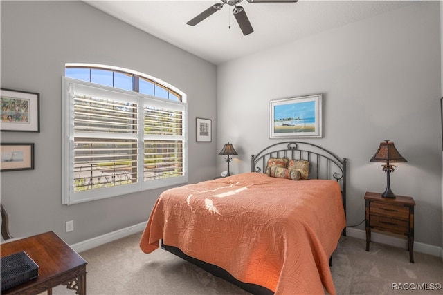 bedroom with ceiling fan and carpet