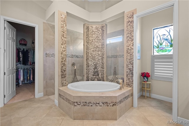 bathroom featuring separate shower and tub and tile patterned flooring