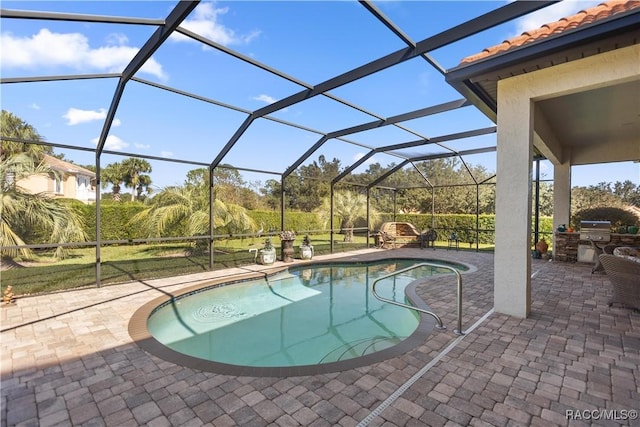 view of swimming pool featuring area for grilling, a patio, and glass enclosure