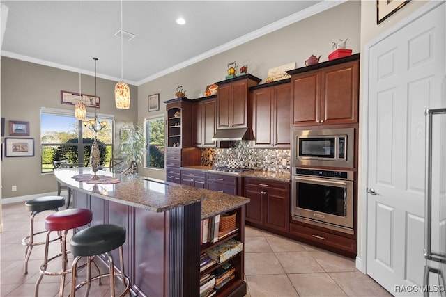 kitchen featuring stone counters, stainless steel appliances, tasteful backsplash, a kitchen island with sink, and light tile patterned floors