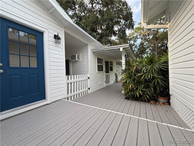 5217 Riverside Dr, Yankeetown, FL 34498 - wooden deck featuring a wall unit AC
