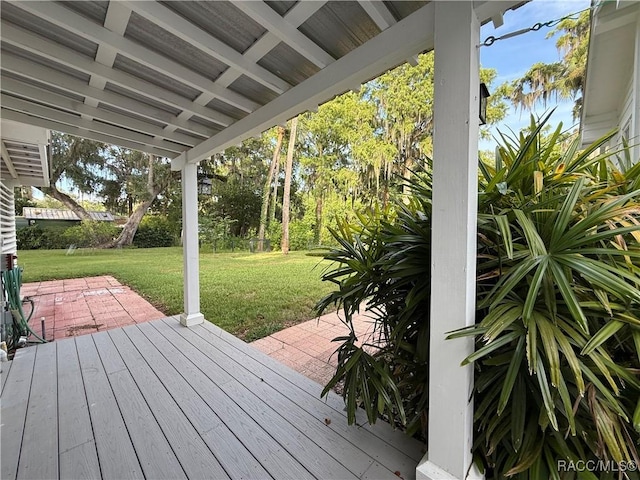 5217 Riverside Dr, Yankeetown, FL 34498 - deck featuring a lawn and a patio area