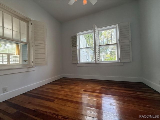 5217 Riverside Dr, Yankeetown, FL 34498 - empty room with dark wood-type flooring, ceiling fan, and vaulted ceiling