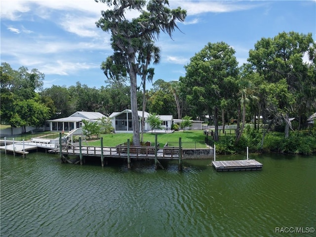 5217 Riverside Dr, Yankeetown, FL 34498 - dock area with a water view and a lawn