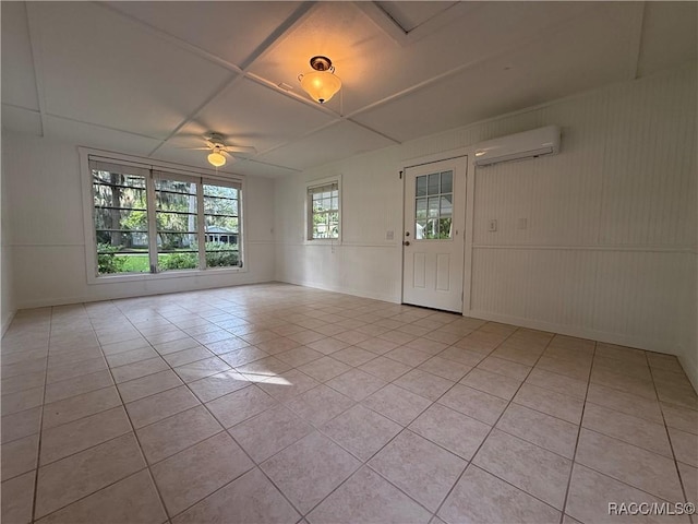 5217 Riverside Dr, Yankeetown, FL 34498 - spare room with a wall unit AC, light tile patterned floors, and a ceiling fan