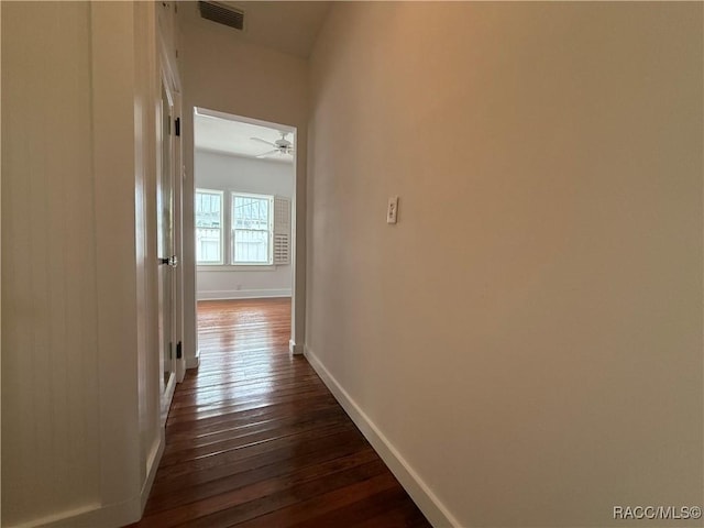 5217 Riverside Dr, Yankeetown, FL 34498 - hallway with dark wood-style flooring and baseboards