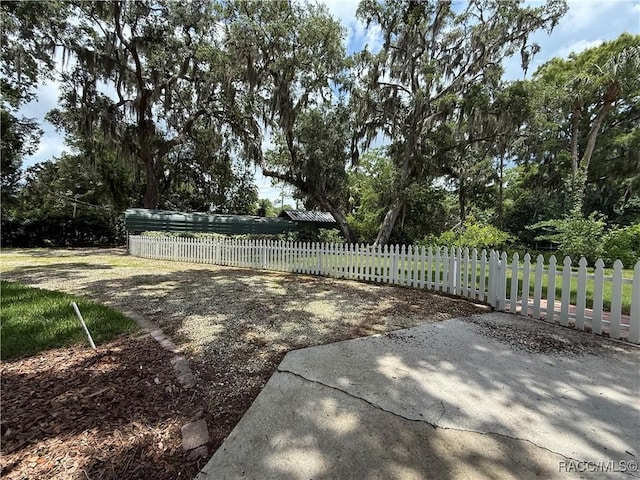 5217 Riverside Dr, Yankeetown, FL 34498 - fenced front yard featuring view of scattered trees