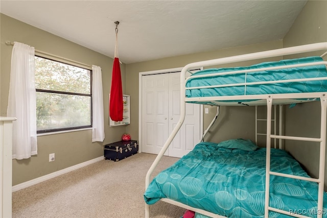 unfurnished bedroom with a closet and carpet floors