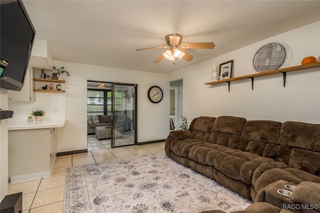 tiled living room with ceiling fan