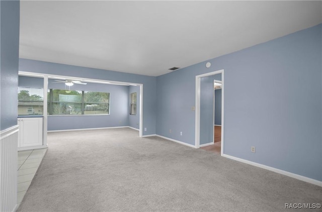 carpeted empty room with ceiling fan