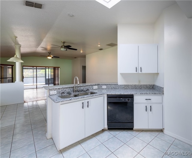 kitchen with kitchen peninsula, vaulted ceiling, sink, black dishwasher, and white cabinetry