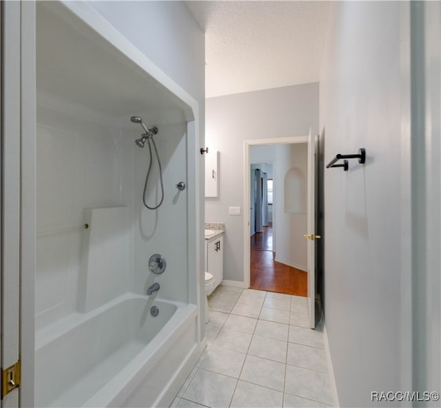 full bathroom featuring tile patterned floors, vanity, toilet, and shower / tub combination