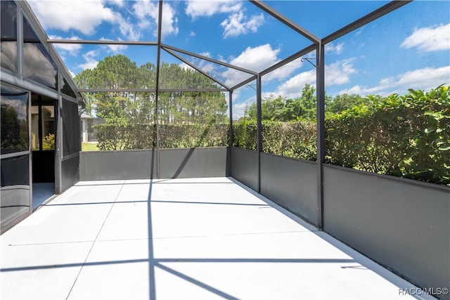 unfurnished sunroom with a wealth of natural light