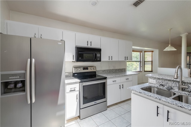 kitchen featuring pendant lighting, white cabinetry, sink, and appliances with stainless steel finishes