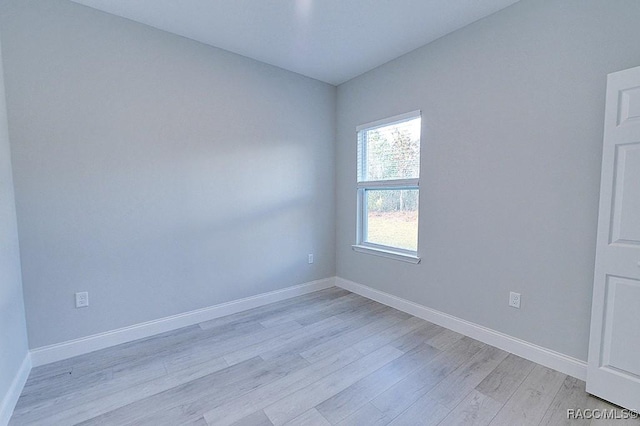 spare room featuring light wood-type flooring