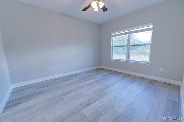 unfurnished room featuring light wood-type flooring and ceiling fan