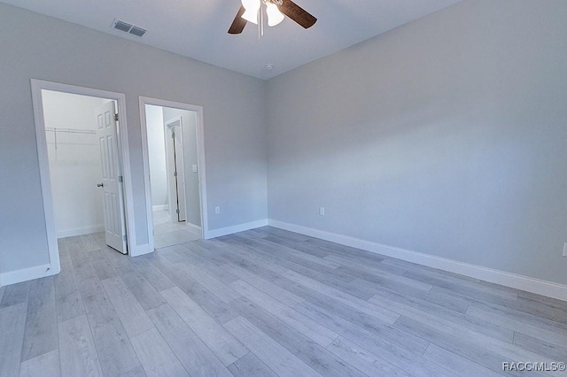 spare room featuring ceiling fan and light hardwood / wood-style flooring