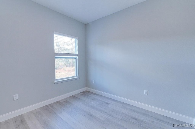 spare room featuring light hardwood / wood-style flooring