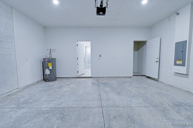 garage featuring electric panel, electric water heater, and a garage door opener