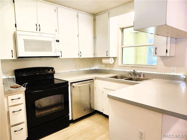 kitchen with white cabinets, sink, light hardwood / wood-style flooring, stainless steel dishwasher, and black / electric stove