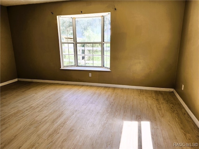 unfurnished room featuring light hardwood / wood-style flooring