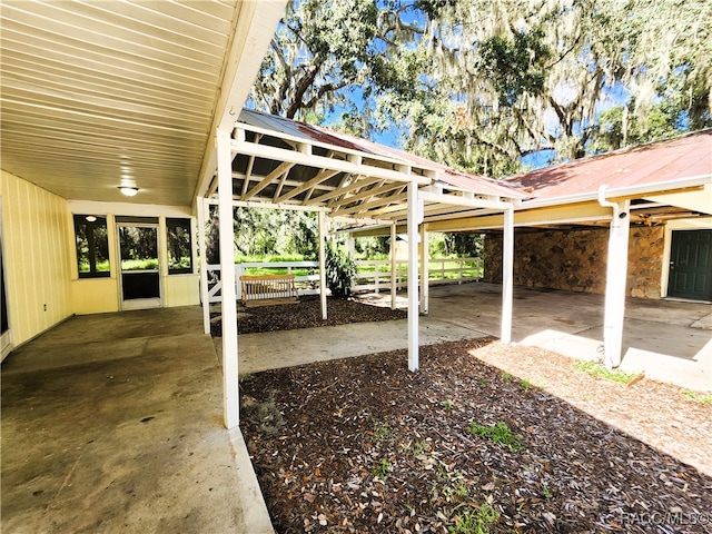 view of patio with an outbuilding