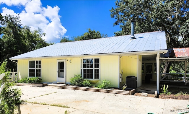 view of front facade featuring covered porch and central air condition unit