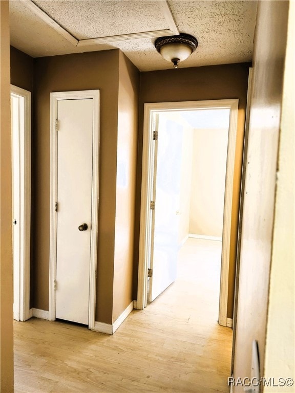 hall with light wood-type flooring