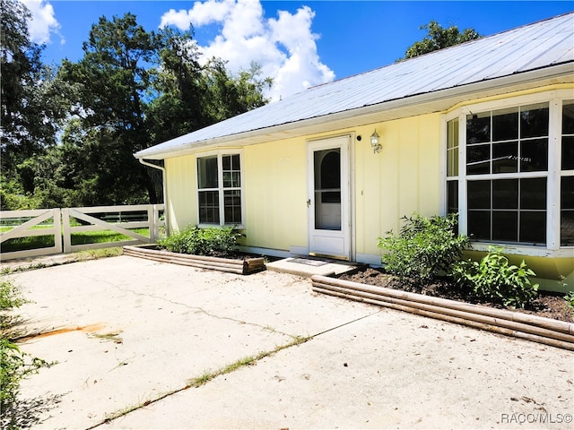 property entrance with a patio