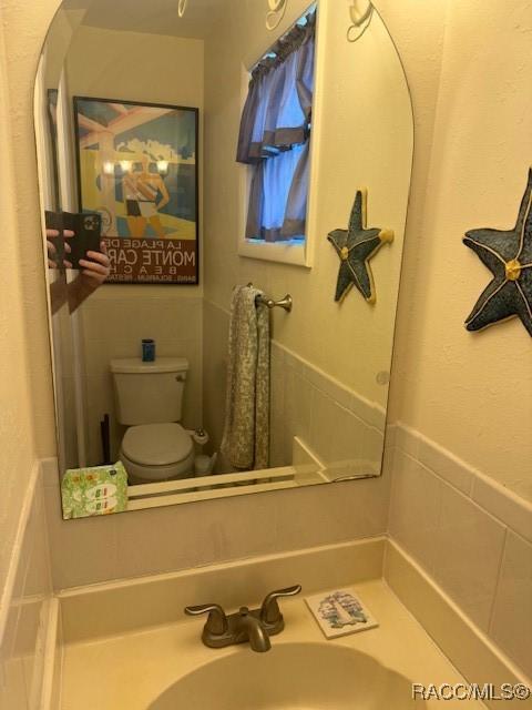 bathroom with a sink and toilet