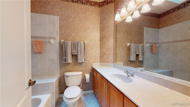 bathroom featuring tile patterned floors, toilet, baseboards, a bath, and vanity