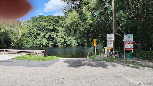 view of community with a water view