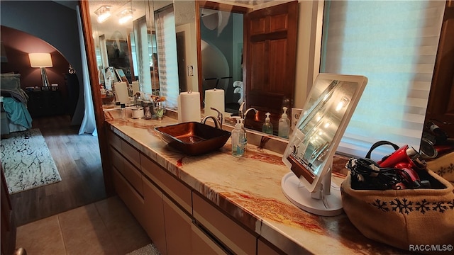 bathroom with hardwood / wood-style flooring and vanity