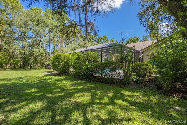 5550 W Yearling Dr, Beverly Hills, FL 34465 - view of grassy yard with a lanai