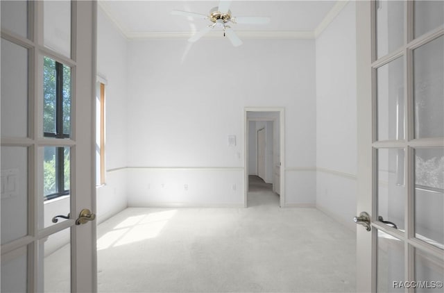 5550 W Yearling Dr, Beverly Hills, FL 34465 - unfurnished room with french doors, carpet, ornamental molding, and ceiling fan