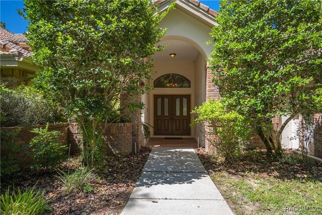 5550 W Yearling Dr, Beverly Hills, FL 34465 - property entrance featuring stucco siding