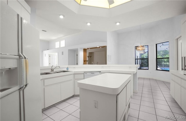 5550 W Yearling Dr, Beverly Hills, FL 34465 - kitchen with white appliances, light tile patterned floors, plenty of natural light, and recessed lighting