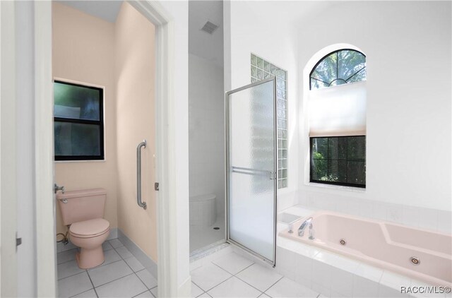 5550 W Yearling Dr, Beverly Hills, FL 34465 - bathroom with a tub with jets, tile patterned flooring, and a shower stall
