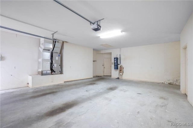 5550 W Yearling Dr, Beverly Hills, FL 34465 - garage with heating unit and a garage door opener