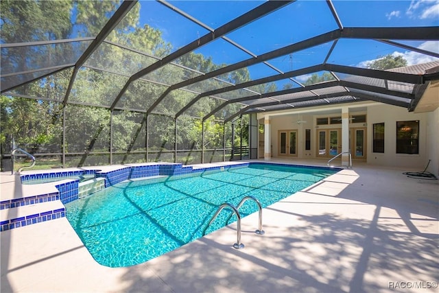 5550 W Yearling Dr, Beverly Hills, FL 34465 - view of pool featuring french doors, a ceiling fan, a pool with connected hot tub, a patio area, and glass enclosure