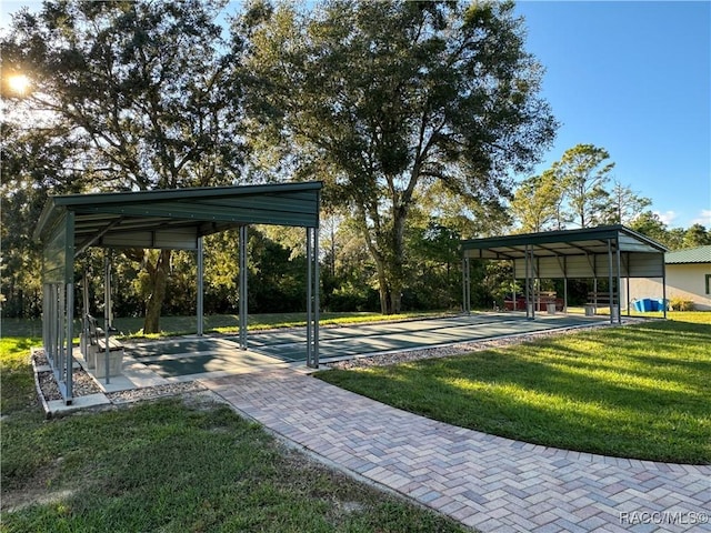 5550 W Yearling Dr, Beverly Hills, FL 34465 - view of property's community with a lawn and a carport