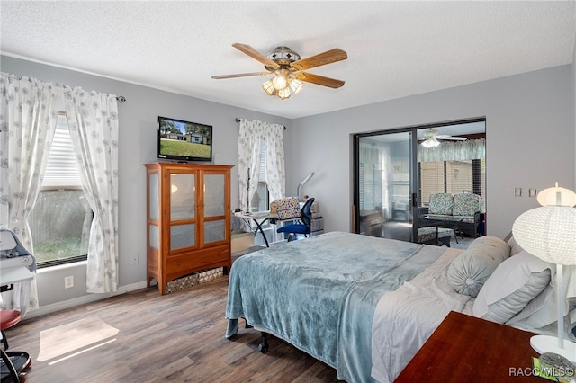 bedroom featuring hardwood / wood-style floors, ceiling fan, and a textured ceiling