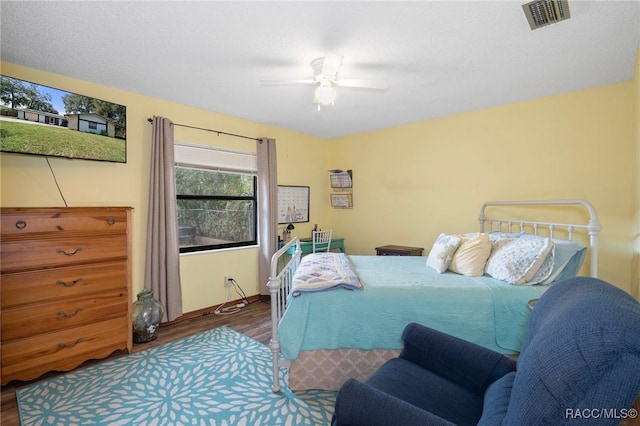 927 Cedar Ave, Inverness, FL 34452 - bedroom with wood finished floors, ceiling fan, and baseboards