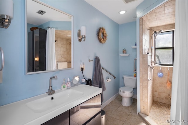 bathroom featuring tile patterned floors, a shower with curtain, toilet, and sink