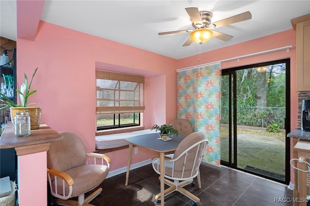 tiled dining area featuring ceiling fan