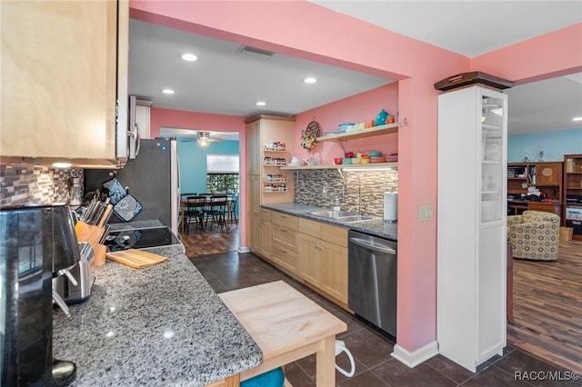 kitchen with dark hardwood / wood-style floors, light brown cabinetry, sink, and appliances with stainless steel finishes