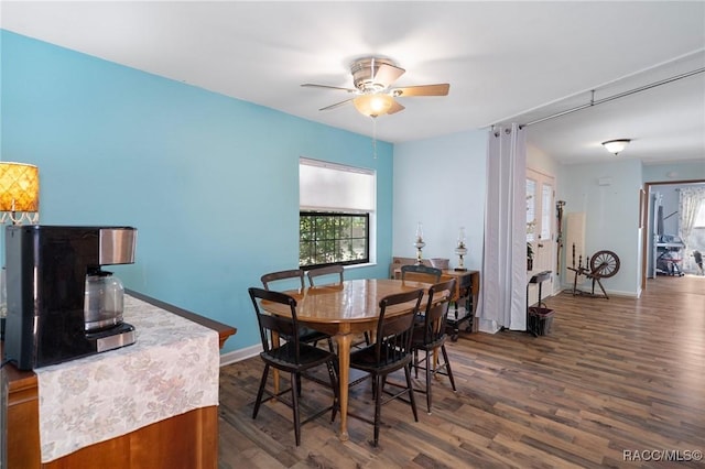 927 Cedar Ave, Inverness, FL 34452 - dining space featuring ceiling fan, dark wood finished floors, and baseboards