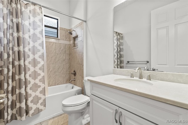 full bathroom featuring toilet, tile patterned floors, vanity, and shower / tub combo with curtain