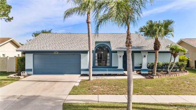 8638 Chadwick Dr, Tampa, FL 33635 - ranch-style house with a garage, stucco siding, a shingled roof, and concrete driveway